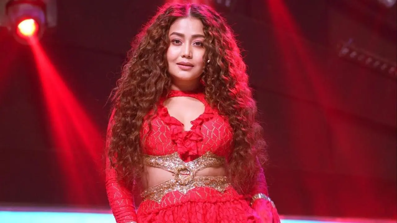 Neha Kakkar Posing for the image and performing on the stage.