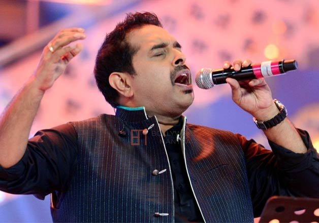 Shankar posing for the image. who is a famous singer.