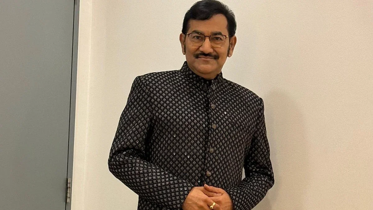 Sudesh bhosle posing for the image.